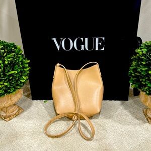 Small neutral beige/ light tan crossbody bag with gold tone trim